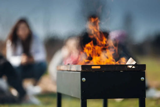 Wood burning in a My BBQ Table charcoal grill